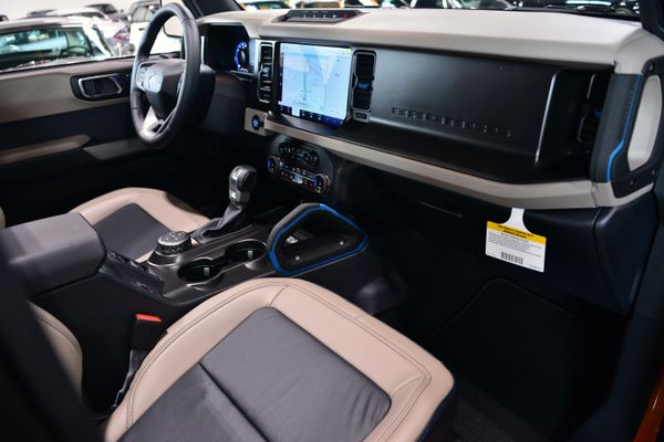 2022 Ford Bronco Wildtrak V6 4-Door, Cyber Orange Metallic, previously sold by Sandbox Motors