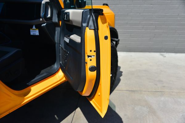 2022 Ford Bronco Wildtrak V6 4-Door, Cyber Orange Metallic, previously sold by Sandbox Motors