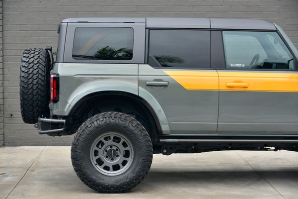 2022 Ford Bronco Wildtrak V6 4-Door, gray with orange accents, previously sold by Sandbox Motors