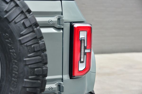 2022 Ford Bronco Wildtrak V6 4-Door, gray with orange accents, previously sold by Sandbox Motors