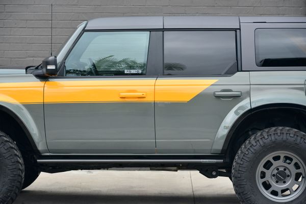 2022 Ford Bronco Wildtrak V6 4-Door, gray with orange accents, previously sold by Sandbox Motors