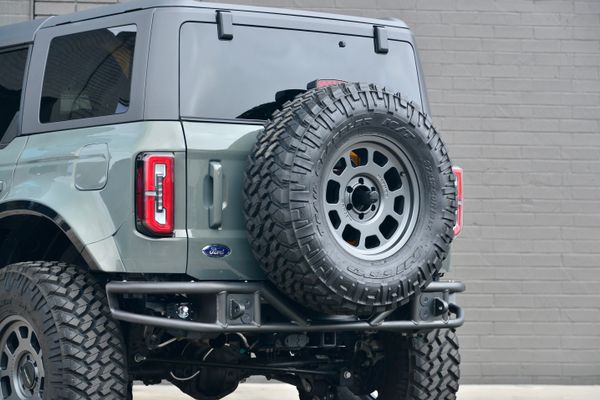 2022 Ford Bronco Wildtrak V6 4-Door, gray with orange accents, previously sold by Sandbox Motors