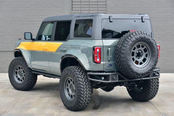 2022 Ford Bronco Wildtrak V6 4-Door, gray with orange accents, previously sold by Sandbox Motors