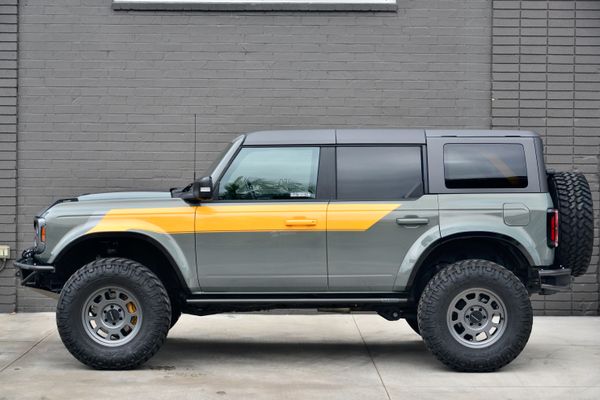 2022 Ford Bronco Wildtrak V6 4-Door, gray with orange accents, previously sold by Sandbox Motors