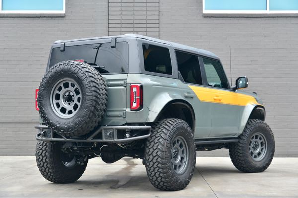 2022 Ford Bronco Wildtrak V6 4-Door, gray with orange accents, previously sold by Sandbox Motors