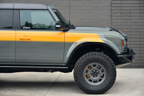 2022 Ford Bronco Wildtrak V6 4-Door, gray with orange accents, previously sold by Sandbox Motors