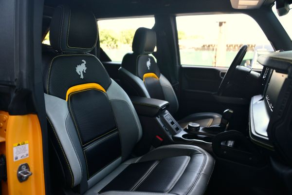 2022 Ford Bronco Wildtrak V6 4-Door, gray with orange accents, previously sold by Sandbox Motors