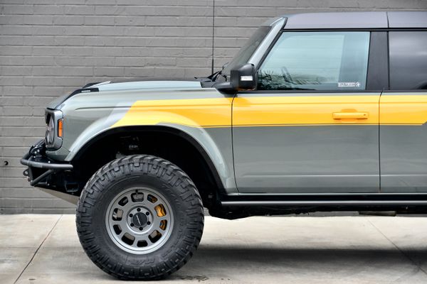 2022 Ford Bronco Wildtrak V6 4-Door, gray with orange accents, previously sold by Sandbox Motors