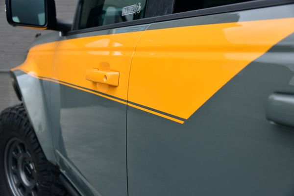2022 Ford Bronco Wildtrak V6 4-Door, gray with orange accents, previously sold by Sandbox Motors