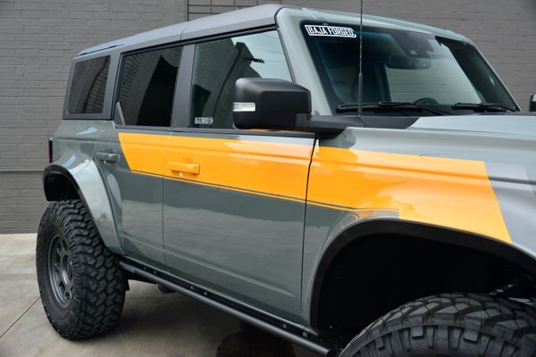 2022 Ford Bronco Wildtrak V6 4-Door, gray with orange accents, previously sold by Sandbox Motors