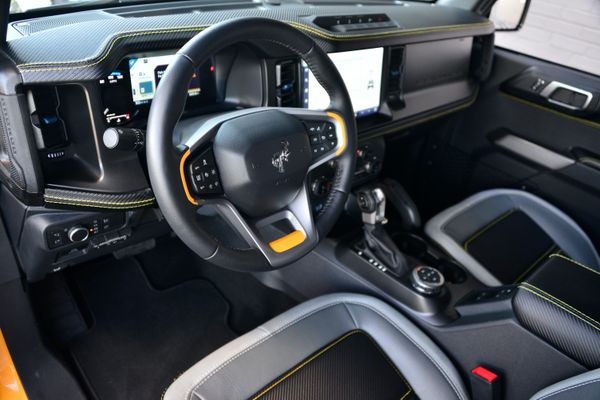 2022 Ford Bronco Wildtrak V6 4-Door, gray with orange accents, previously sold by Sandbox Motors