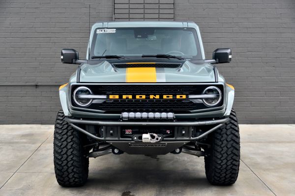 2022 Ford Bronco Wildtrak V6 4-Door, gray with orange accents, previously sold by Sandbox Motors