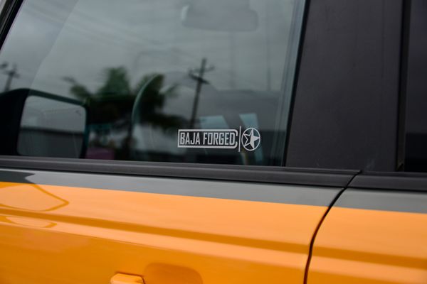 2022 Ford Bronco Wildtrak V6 4-Door, gray with orange accents, previously sold by Sandbox Motors