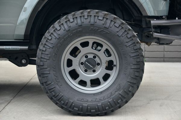 2022 Ford Bronco Wildtrak V6 4-Door, gray with orange accents, previously sold by Sandbox Motors
