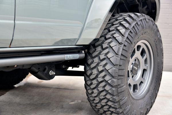 2022 Ford Bronco Wildtrak V6 4-Door, gray with orange accents, previously sold by Sandbox Motors