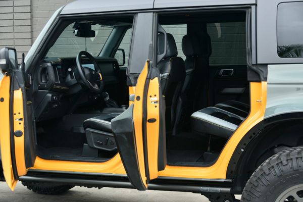 2022 Ford Bronco Wildtrak V6 4-Door, gray with orange accents, previously sold by Sandbox Motors