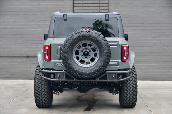 2022 Ford Bronco Wildtrak V6 4-Door, gray with orange accents, previously sold by Sandbox Motors