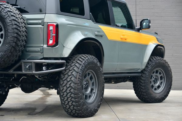 2022 Ford Bronco Wildtrak V6 4-Door, gray with orange accents, previously sold by Sandbox Motors