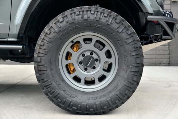 2022 Ford Bronco Wildtrak V6 4-Door, gray with orange accents, previously sold by Sandbox Motors
