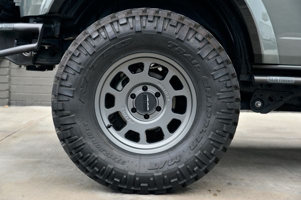 2022 Ford Bronco Wildtrak V6 4-Door, gray with orange accents, previously sold by Sandbox Motors