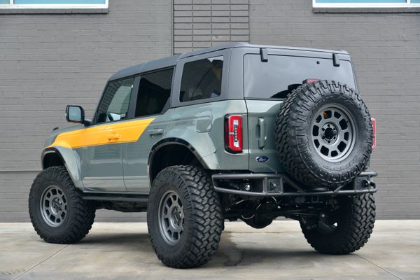 2022 Ford Bronco Wildtrak V6 4-Door, gray with orange accents, previously sold by Sandbox Motors