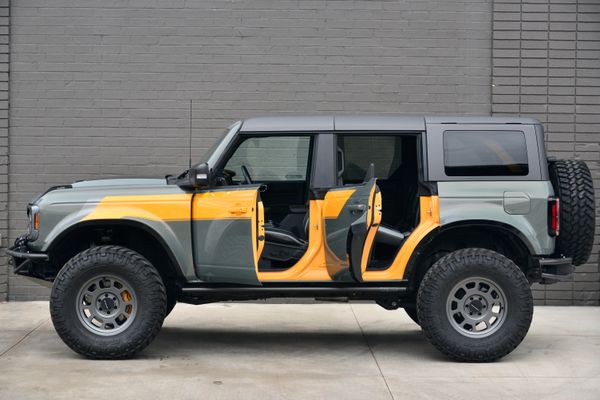 2022 Ford Bronco Wildtrak V6 4-Door, gray with orange accents, previously sold by Sandbox Motors