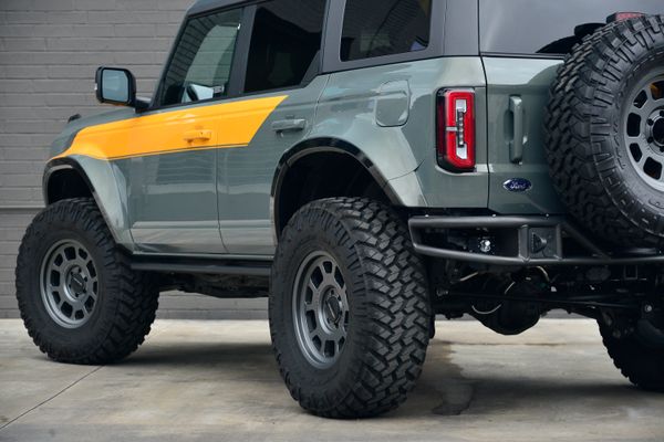 2022 Ford Bronco Wildtrak V6 4-Door, gray with orange accents, previously sold by Sandbox Motors
