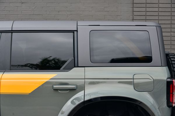 2022 Ford Bronco Wildtrak V6 4-Door, gray with orange accents, previously sold by Sandbox Motors