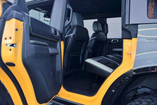 2022 Ford Bronco Wildtrak V6 4-Door, gray with orange accents, previously sold by Sandbox Motors
