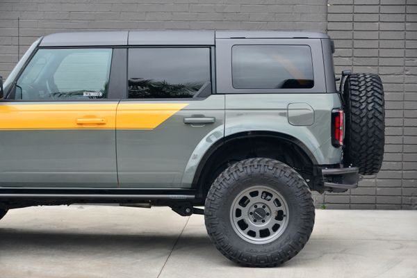 2022 Ford Bronco Wildtrak V6 4-Door, gray with orange accents, previously sold by Sandbox Motors