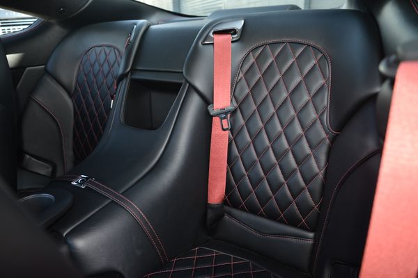 Black and red 2015 Aston Martin Vanquish Q Collection for sale by Sandbox Motors.