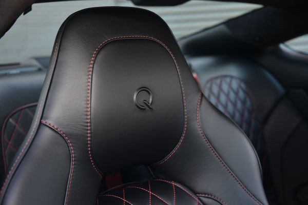 Black and red 2015 Aston Martin Vanquish Q Collection for sale by Sandbox Motors.