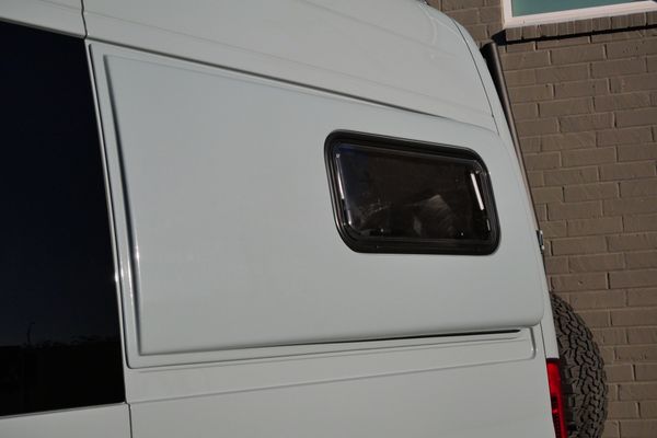 Silver 2022 Mercedes-Benz Sprinter 2500 4x4 custom camper conversion for sale by Sandbox Motors.