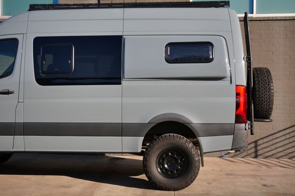 Silver 2022 Mercedes-Benz Sprinter 2500 4x4 custom camper conversion for sale by Sandbox Motors.