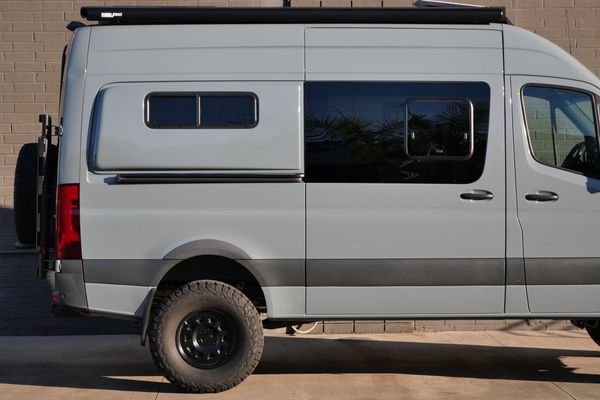 Silver 2022 Mercedes-Benz Sprinter 2500 4x4 custom camper conversion for sale by Sandbox Motors.
