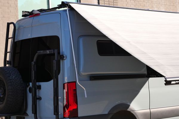 Silver 2022 Mercedes-Benz Sprinter 2500 4x4 custom camper conversion for sale by Sandbox Motors.