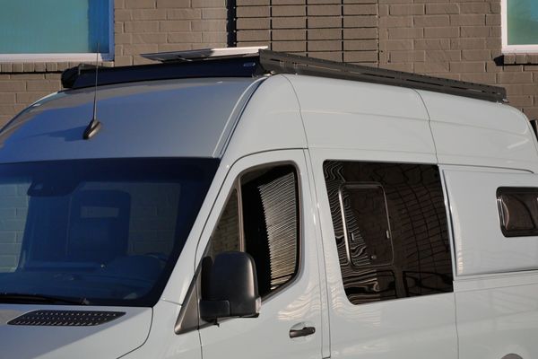 Silver 2022 Mercedes-Benz Sprinter 2500 4x4 custom camper conversion for sale by Sandbox Motors.