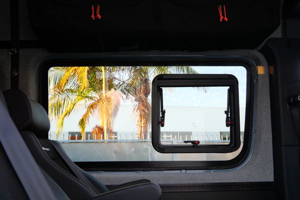 Silver 2022 Mercedes-Benz Sprinter 2500 4x4 custom camper conversion for sale by Sandbox Motors.