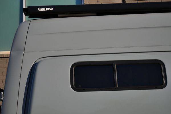 Silver 2022 Mercedes-Benz Sprinter 2500 4x4 custom camper conversion for sale by Sandbox Motors.