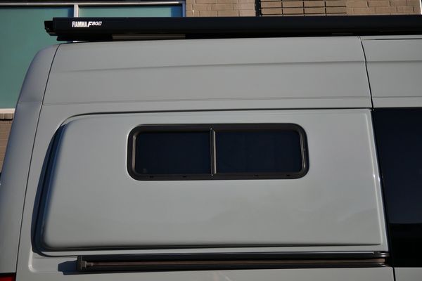 Silver 2022 Mercedes-Benz Sprinter 2500 4x4 custom camper conversion for sale by Sandbox Motors.