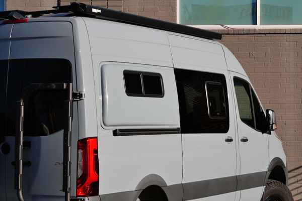 Silver 2022 Mercedes-Benz Sprinter 2500 4x4 custom camper conversion for sale by Sandbox Motors.
