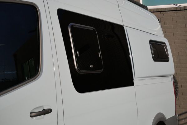 Silver 2022 Mercedes-Benz Sprinter 2500 4x4 custom camper conversion for sale by Sandbox Motors.
