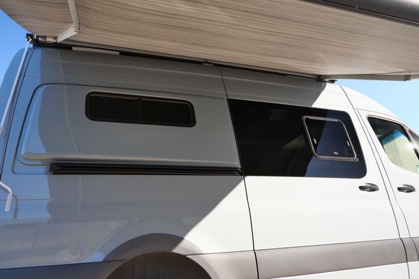 Silver 2022 Mercedes-Benz Sprinter 2500 4x4 custom camper conversion for sale by Sandbox Motors.