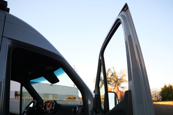 Silver 2022 Mercedes-Benz Sprinter 2500 4x4 custom camper conversion for sale by Sandbox Motors.